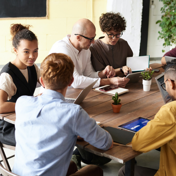 photo-of-people-gathering-around-table-3182785 1