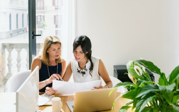 Two-people-looking-at-plans-social-sharing